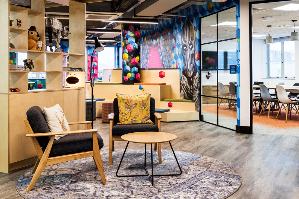 Scandi Upholstered Lounge Armchair With Coffee Table And Shelves In Breakout Setting