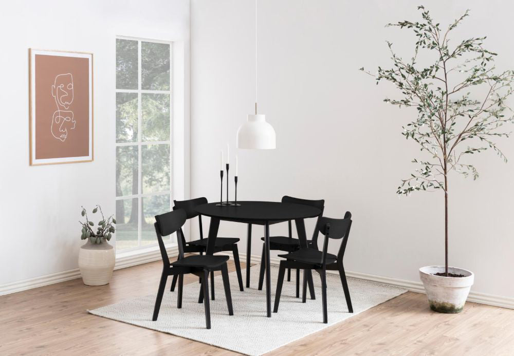 Sierra Round Dining Table Black with Indoor Plant and Chair in Bedroom Setting