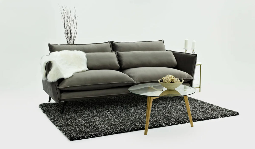 Silas 3 Seater Sofa in Black Finish Side and Coffee Table in Studio Setting