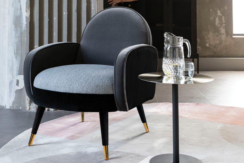 Sofia Lounge Chair in Black Grey Finish with Side Table and Floor Carpet in Breakout Setting