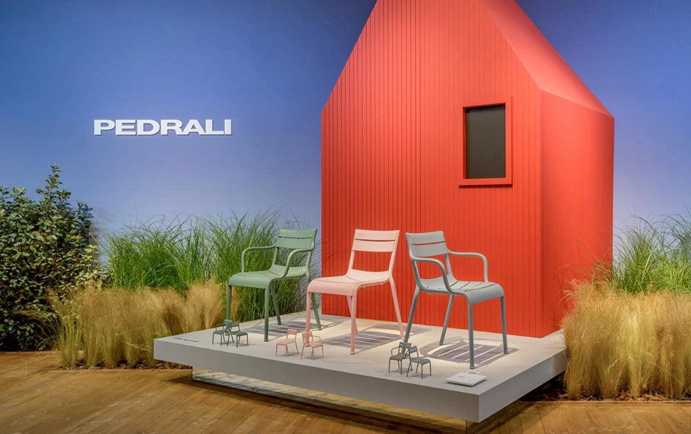 Souvenir Dining Chair in Pink Finish with Miniature Chairs in Outdoor Setting