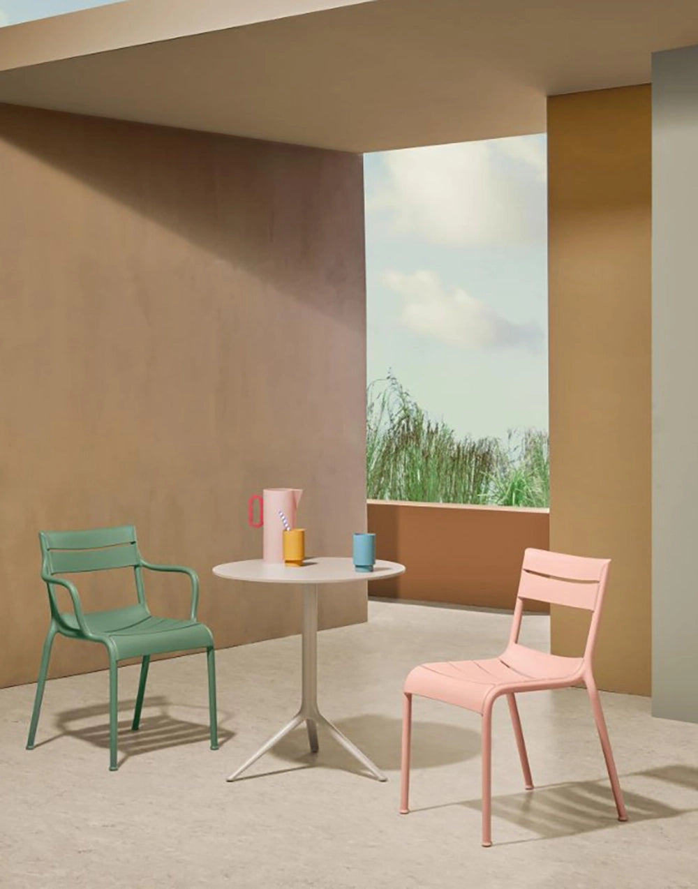 Souvenir Dining Chair in Pink Finishwith Round Table in Pitcher in Outdoor Setting