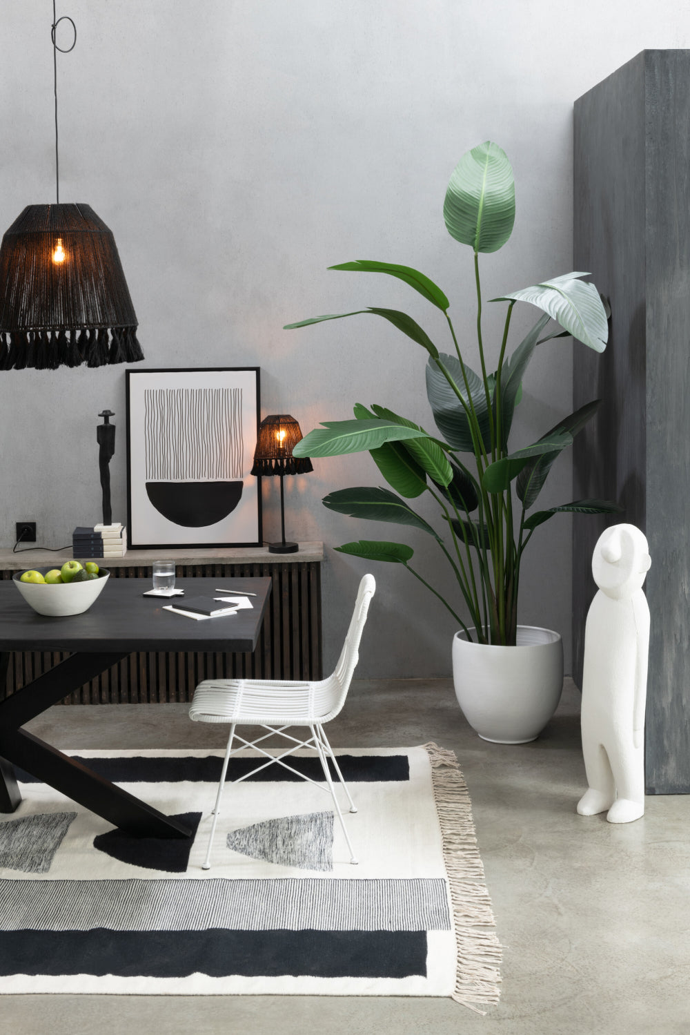 Sterlitzia Synthetic Green Plant Large with Dining Table and Rug in Living Room Setting