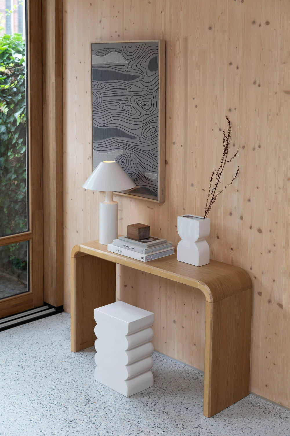 Teagan Hall Console Table with Lampshade and Wall Art in Living Room Setting