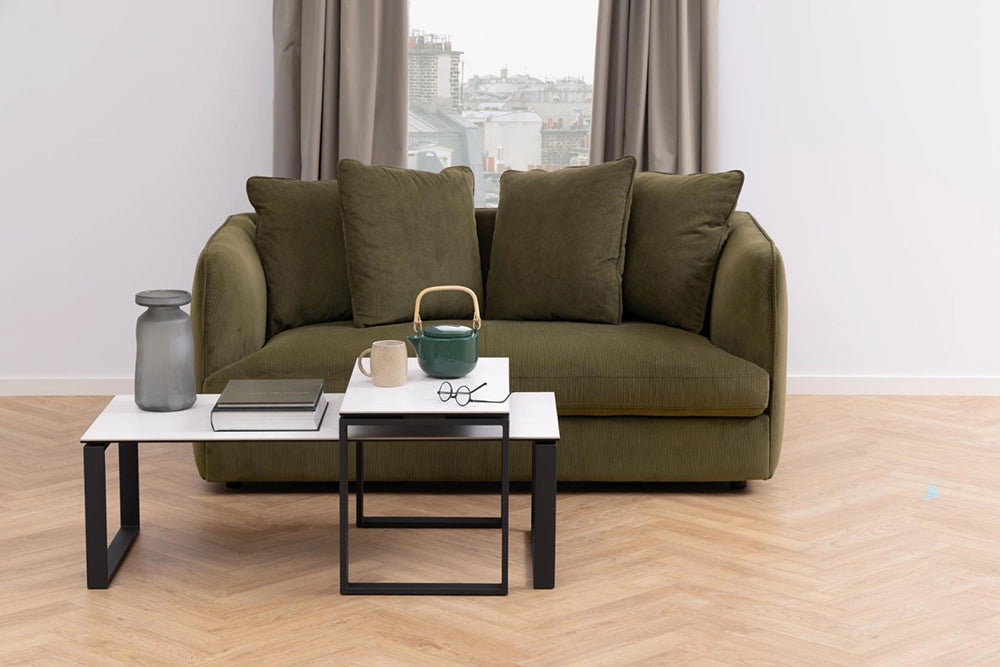 Trina Coffee Table in Marble Black Finish with Upholstered Sofa and Eyeglass in Living Room Setting