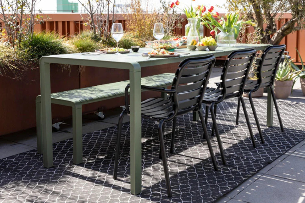 Vera Outdoor Armchair in Black Finish with Table and Bench in Outdoor Setting 2