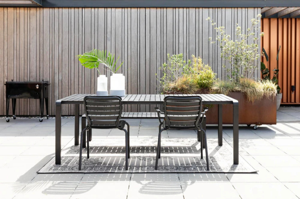 Vera Outdoor Armchair in Black Finish with Table and Bench in Outdoor Setting