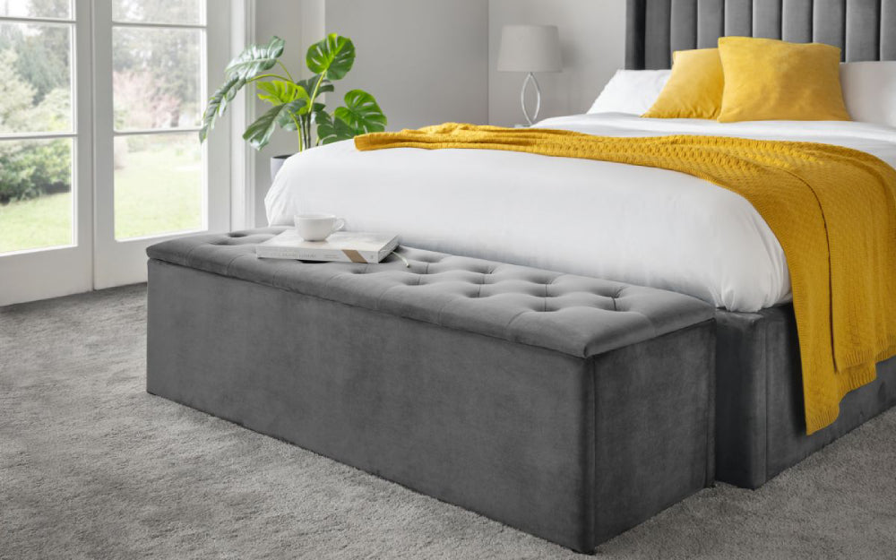 Verona Upholstered Blanket Box in Dark Grey Finish with Throw and Cushion in Bedroom Setting