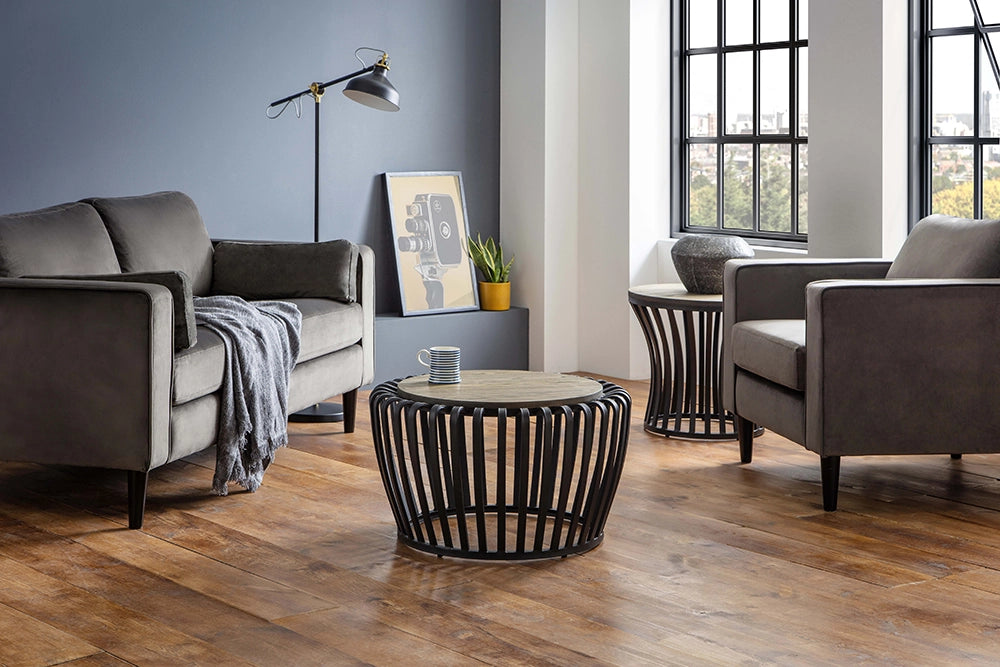 York Round Coffee Table in Wooden Top Finish with Grey Armchair and Standing Black Lamp in Studio Setting