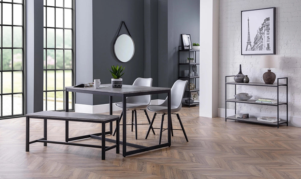 Adele Concrete Dining Table with Two Grey Chairs and Bench in Breakout Setting