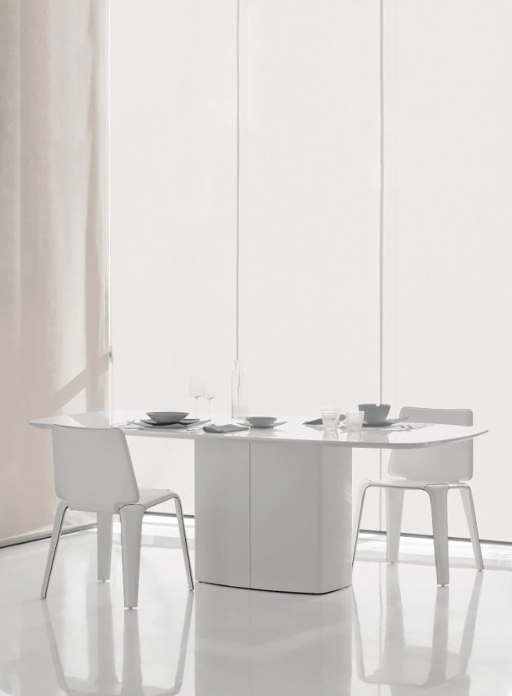 Aero Dining Table in White Finish with White Chair in Breakout Setting