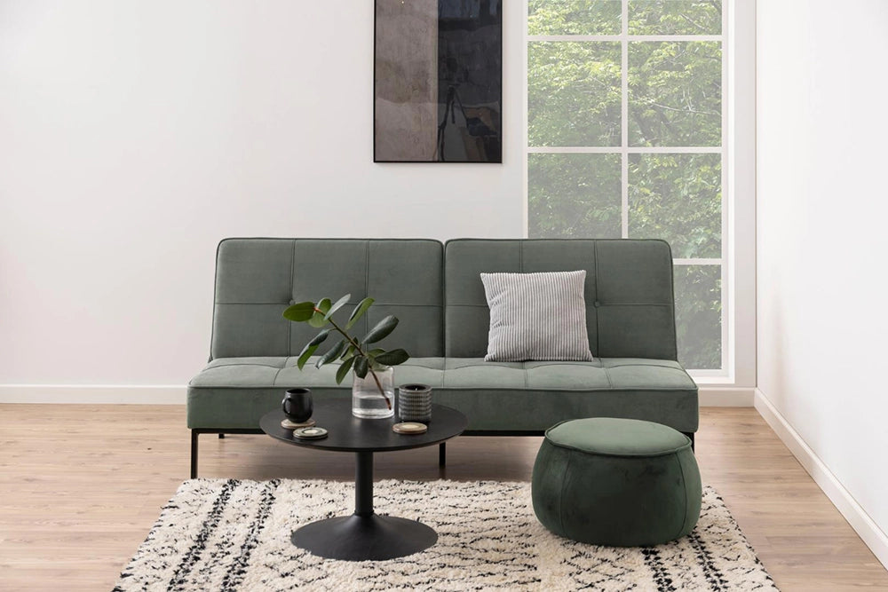 Antonio Coffee Table in Black Finish with Upholstered Green Sofa and Pouf in Living Room Setting
