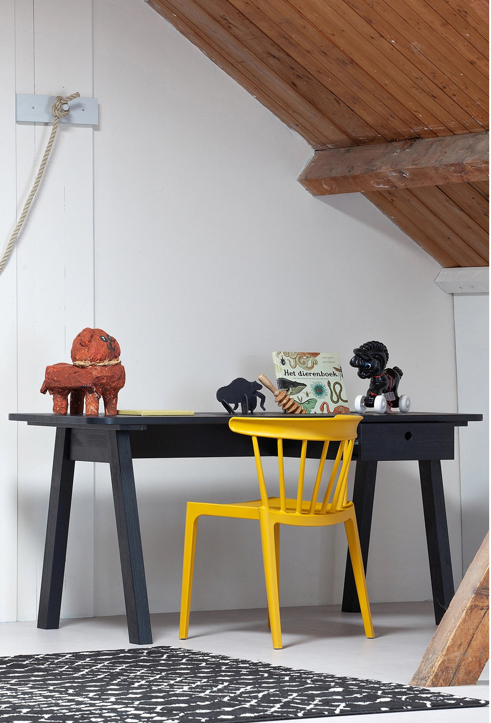 Ash Polypropylene Chair Ochre 4 with Rectangular Black Table and Animal Figurine in Attic Bedroom Setting