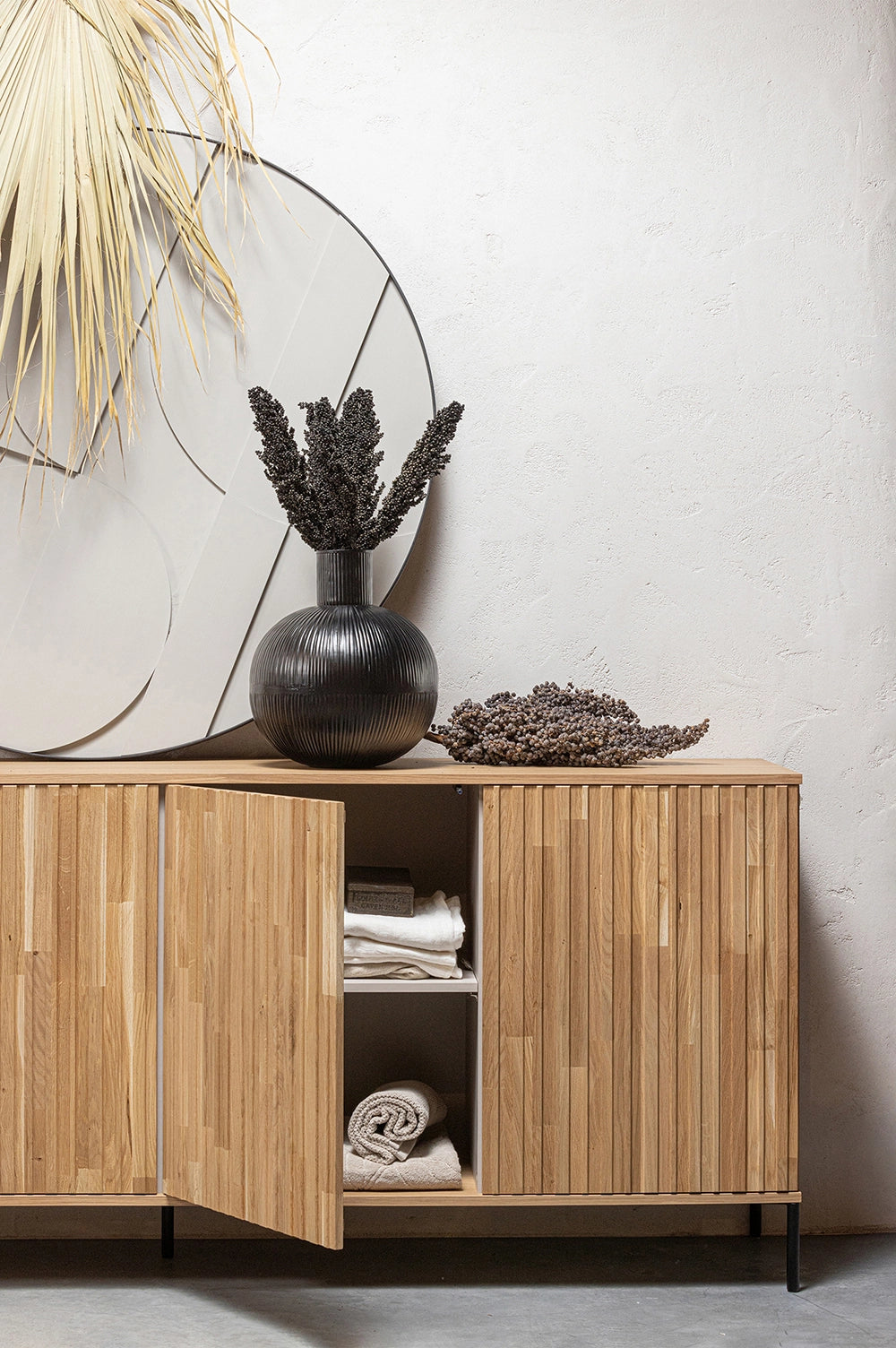 Ashley Graphic Embossed Sideboard in Natural Oak Finish with Dried Plants in Living Room Setting 2