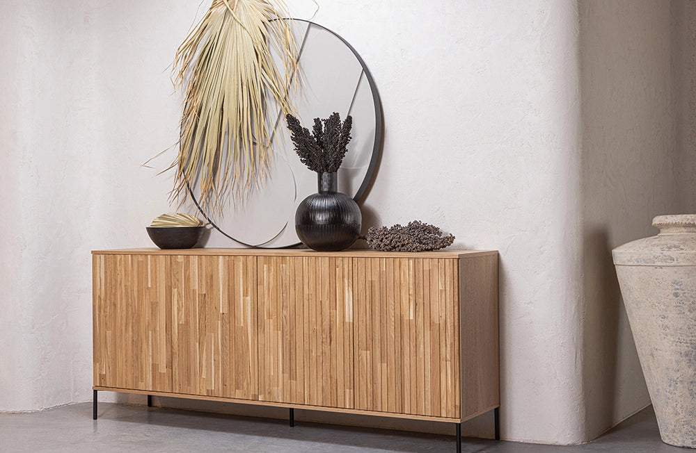 Ashley Graphic Embossed Sideboard in Natural Oak Finish with Dried Plants in Living Room Setting