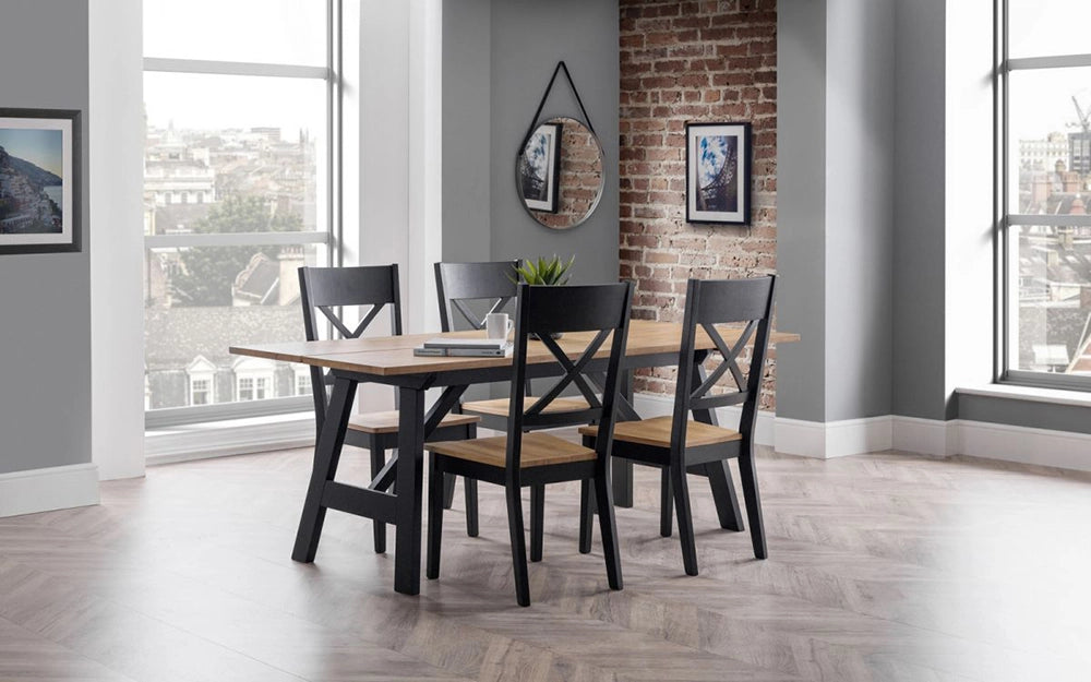 Ava Dining Table in Black Oak Finish with Four Wooden Chairs and Round Mirror in Breakout Setting