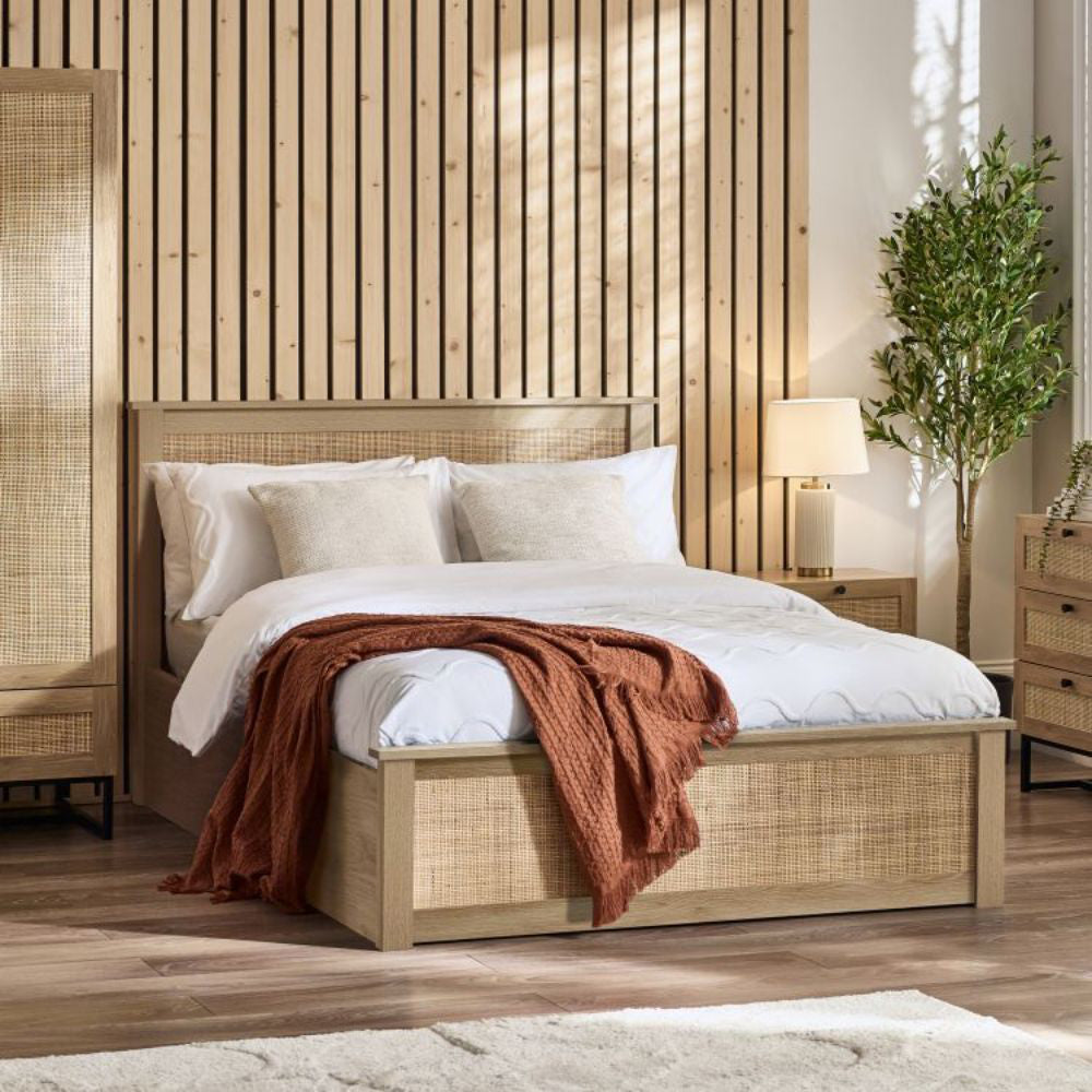 Bari Storage Bed Frame in Oak Finish with Lampshade and Indoor Plant in Bedroom Setting