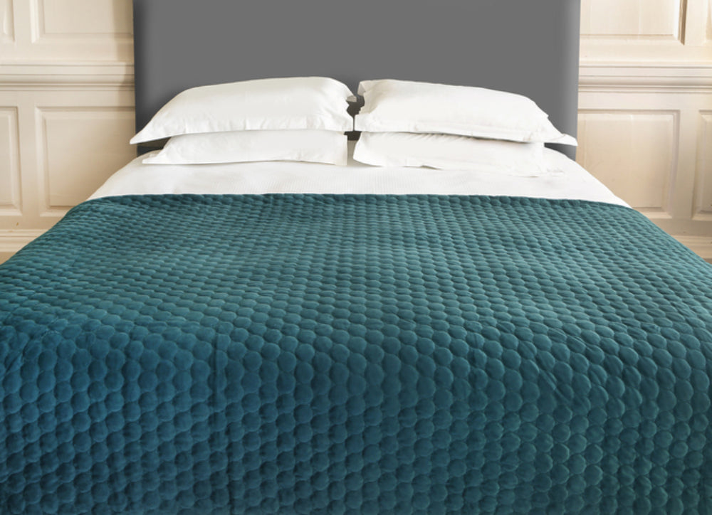 Bedspread Geometric Throw in Teal Finish with Pillows in Bedroom Setting