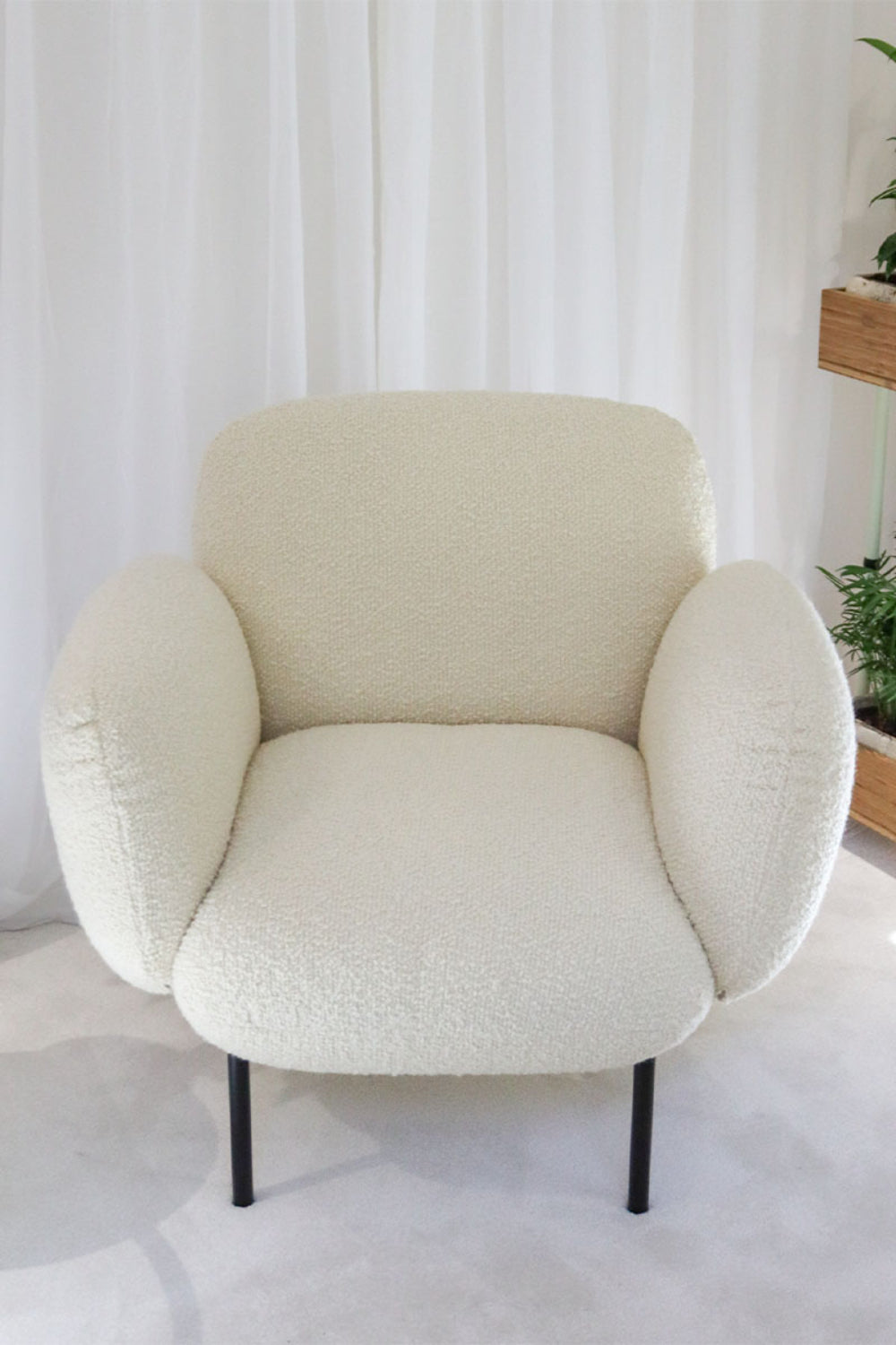 Boho Lounge Armchair In White Finish With Indoor Plant In Living Room Setting