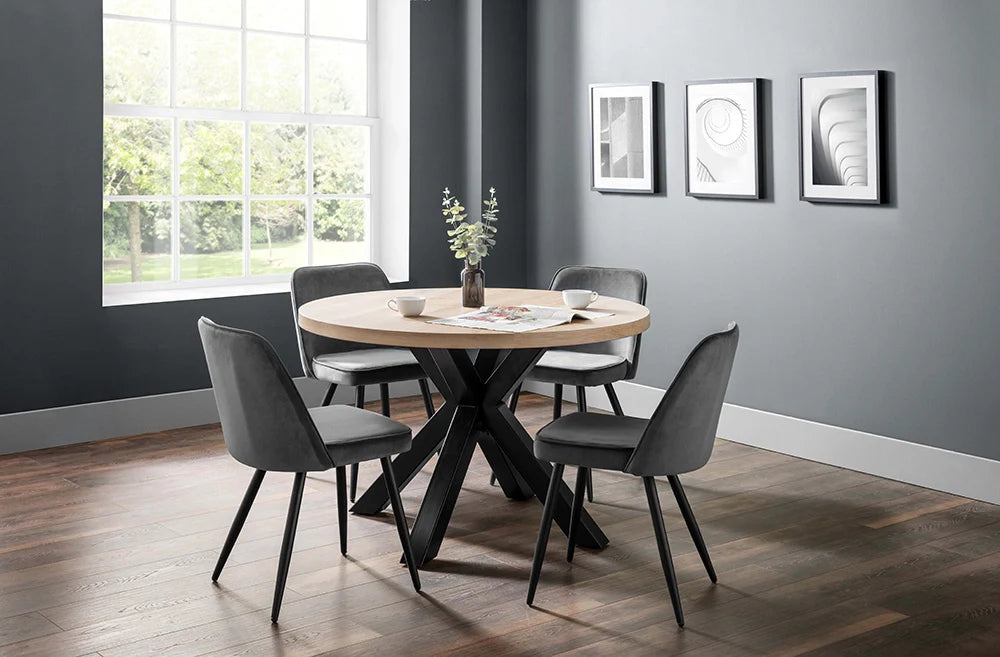 Burnwick Round Dining Table with Dining Chair and Wall Frame in Breakout Setting 2