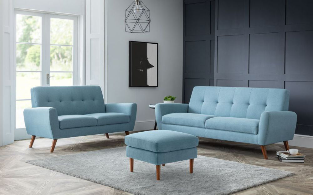Capri Sofa Bed Blue with Wall Mirror and 2 Seater Sofa in Living Room Setting