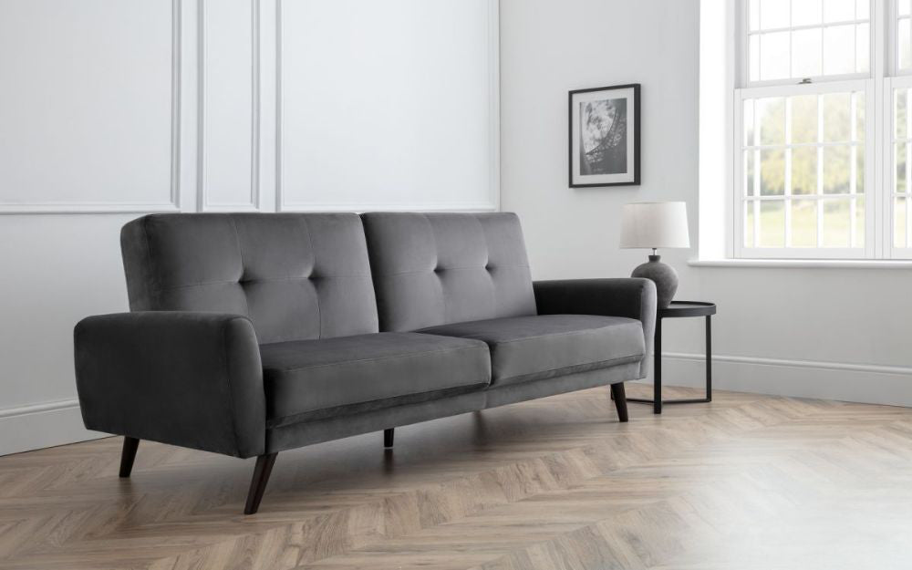 Capri Sofa Bed Dark Grey Velvet with Side Table and Lampshade in Living Room Setting 2
