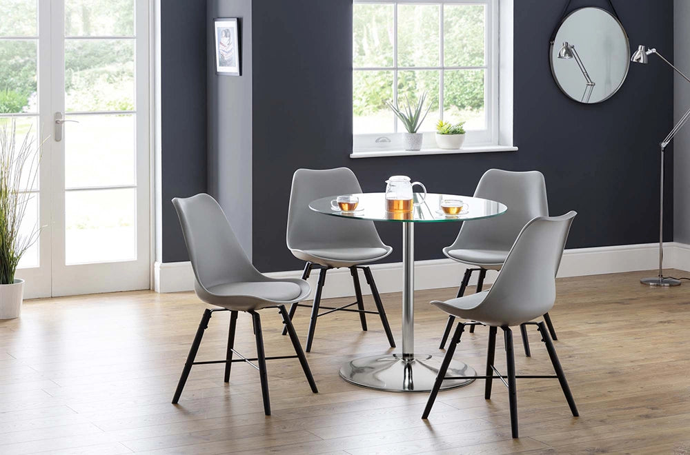 Cari Dining Chair in Black Finish with Round Glass Top Table and Standing Lamp in Living Room Setting