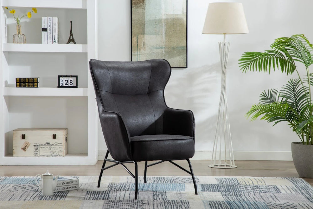 Carter High Backrest Accent Chair in Black Finish with Lamp and Plant in Living Room Setting