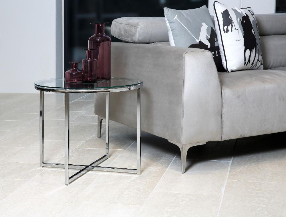 Cato Side Table in Clear Tempered Glass and Chrome Finish with Sofa and Vase in Living Room Setting