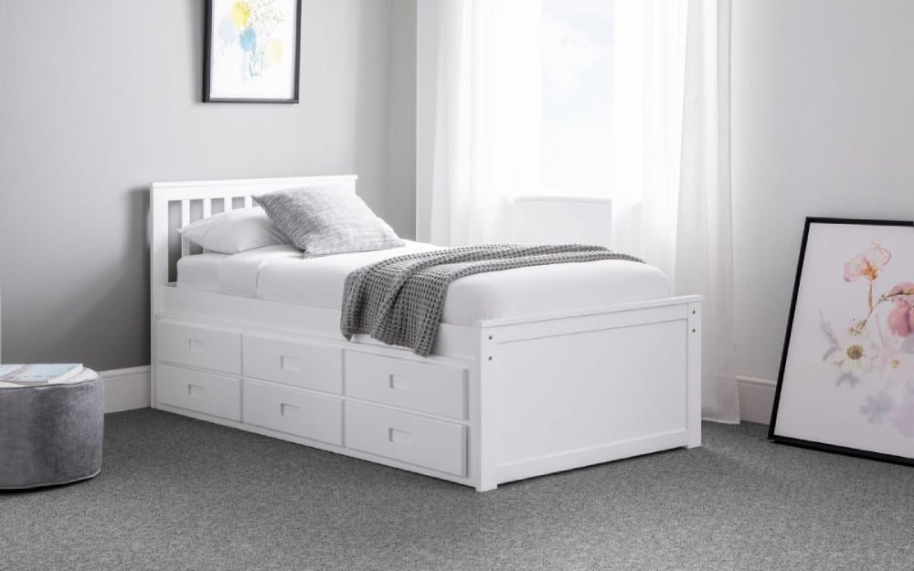 Cian Day Bed White with Pouffe and Wall Art in Bedroom Setting
