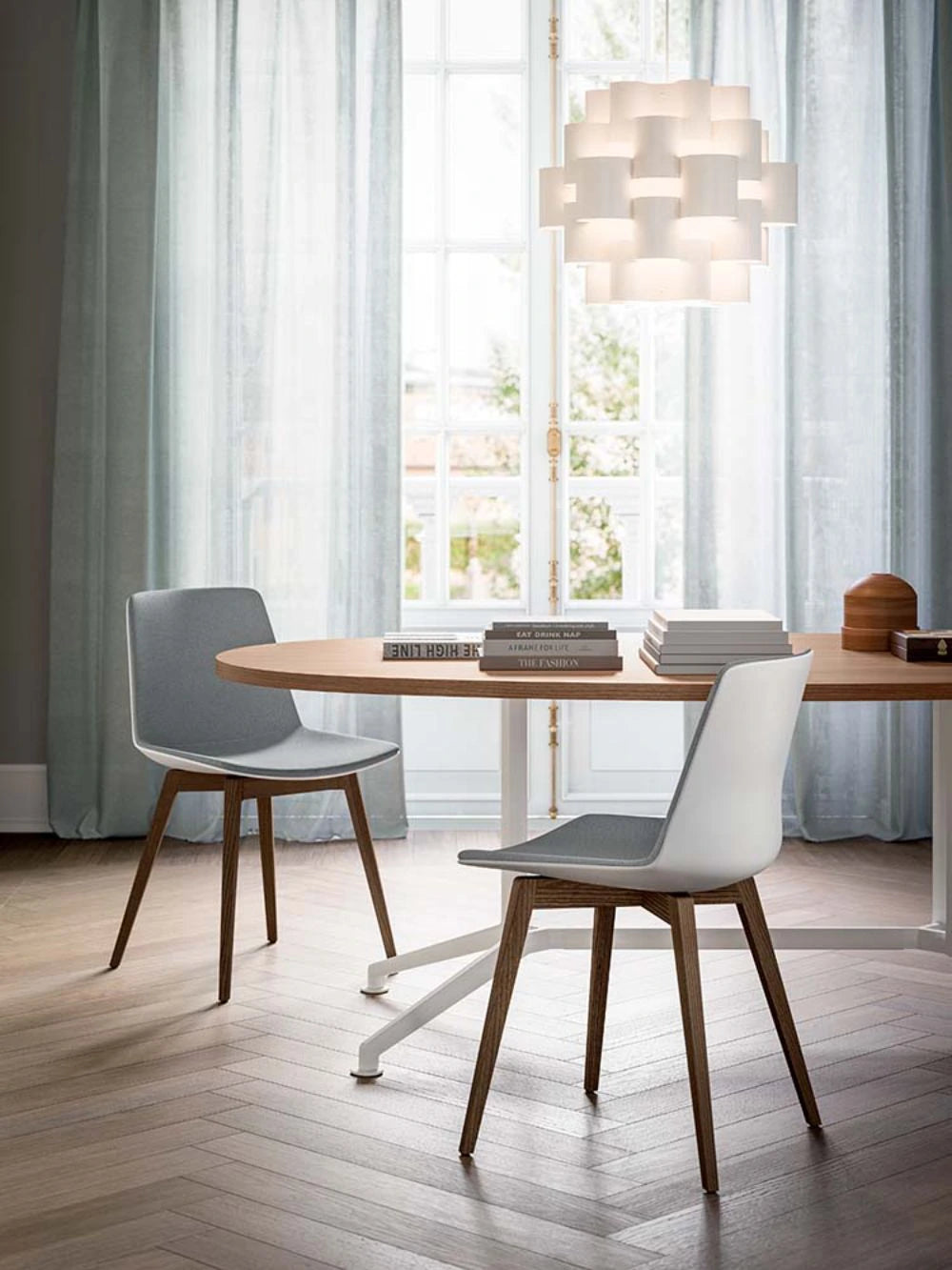 Compass Dining Chair In White With Oval Shaped Table