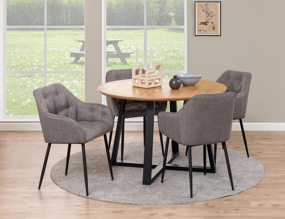 Court Round Dining Table in Oak Black Finish with Brown Armchair and Wall Frame in Dining Setting