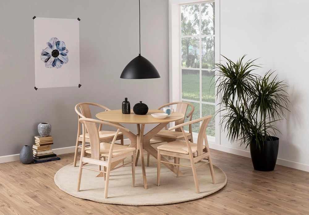 Danica Round Dining Table in White Oak Finish with Wooden Chair and Indoor Plant in Breakout Setting