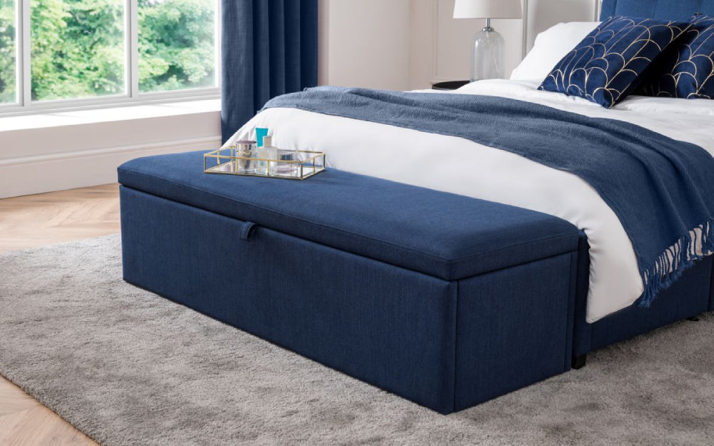 Delmar Upholstered Blanket Box in Blue Finish with Pillows and Lampshade in Bedroom Setting