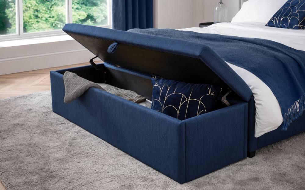 Delmar Upholstered Blanket Box in Blue Finish with Pillows and Rug in Bedroom Setting