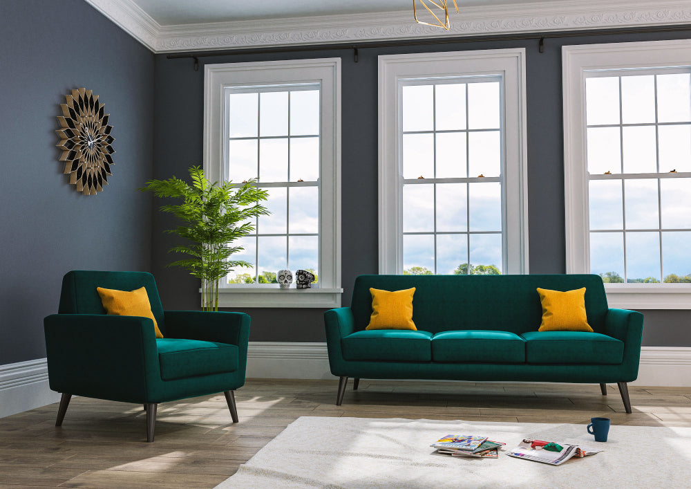 Detroit Upholstered Sofa and Armchair in Green Finish with Indoor Plant and Clock in Living Room Setting