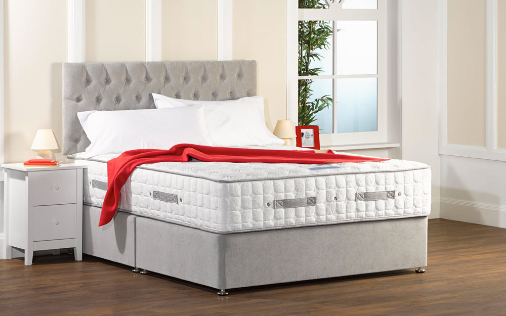 Divan Bed with Grey Headboard with White Bedside Cabinet and Red Blanket in Bedroom Settings