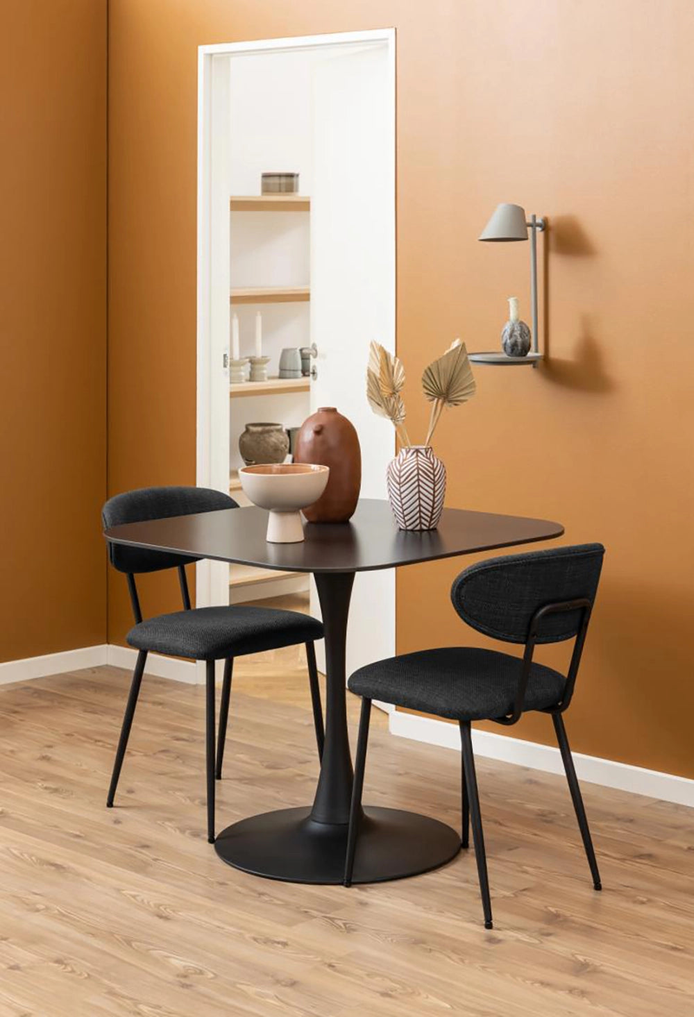 Dune Square Dining Table in Black Finish with Upholstered Chair and Wall Lampshade in Breakout Setting