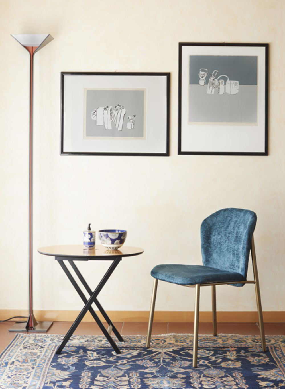 Finn Padded Chair with Wall Art and Round Table in Living Room Setting