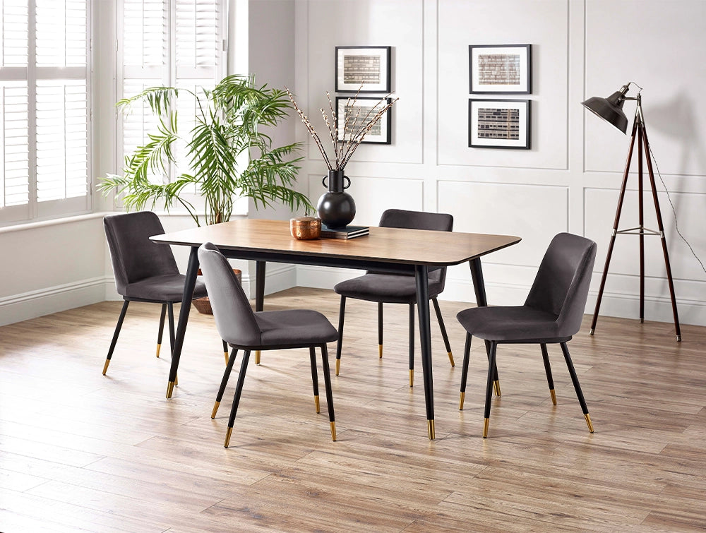Fintan Rectangular Dining Table in Walnut and Black Finish with Green Chair and Indoor Plant in Dining Setting