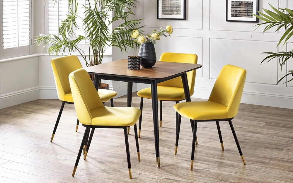 Fintan Rectangular Dining Table in Walnut and Black Finish with Yellow Chair and Indoor Plant in Dining Setting