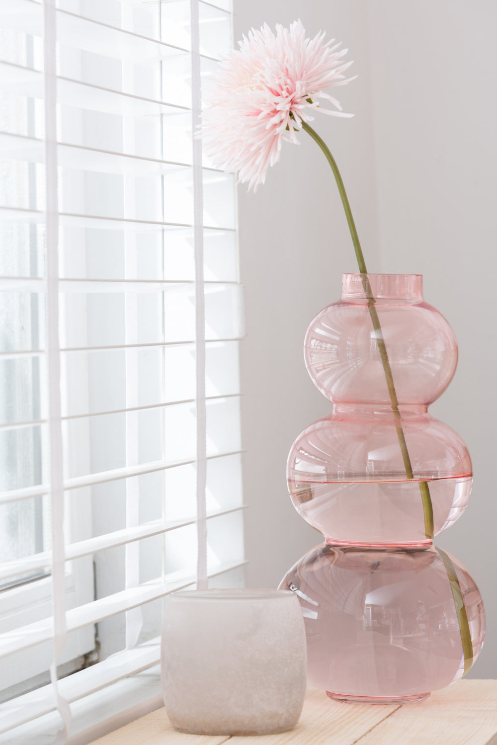 Glass Globe Shaped Large Vase in Pink Finish with Table in Living Room Setting 2