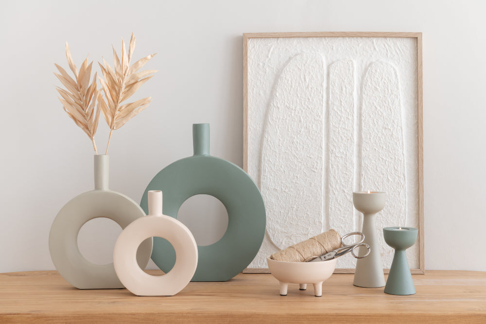 Green Metal Round Vase with White Vase and Scissor in Living Room Setting