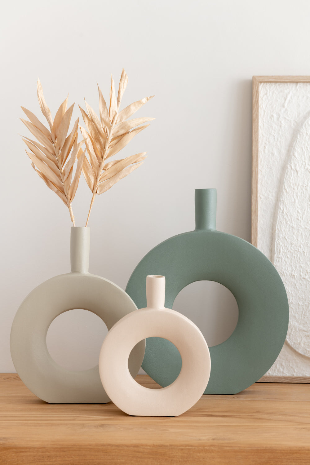 Green Metal Round Vase with White Vase in Living Room Setting