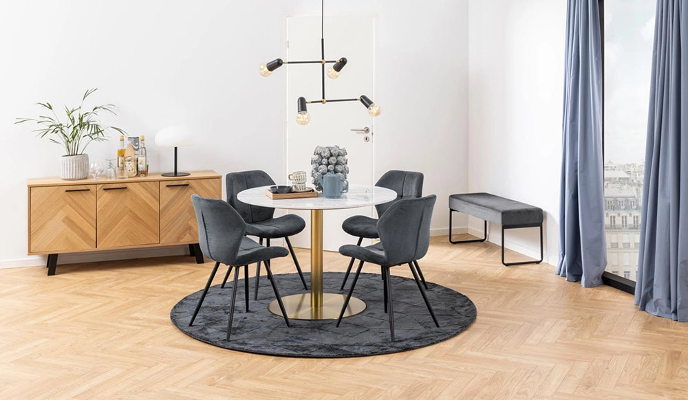 Hamilton Sideboard in Oak Finish with Round Marble Top Table and Upholstered Grey Chair in Breakout Setting
