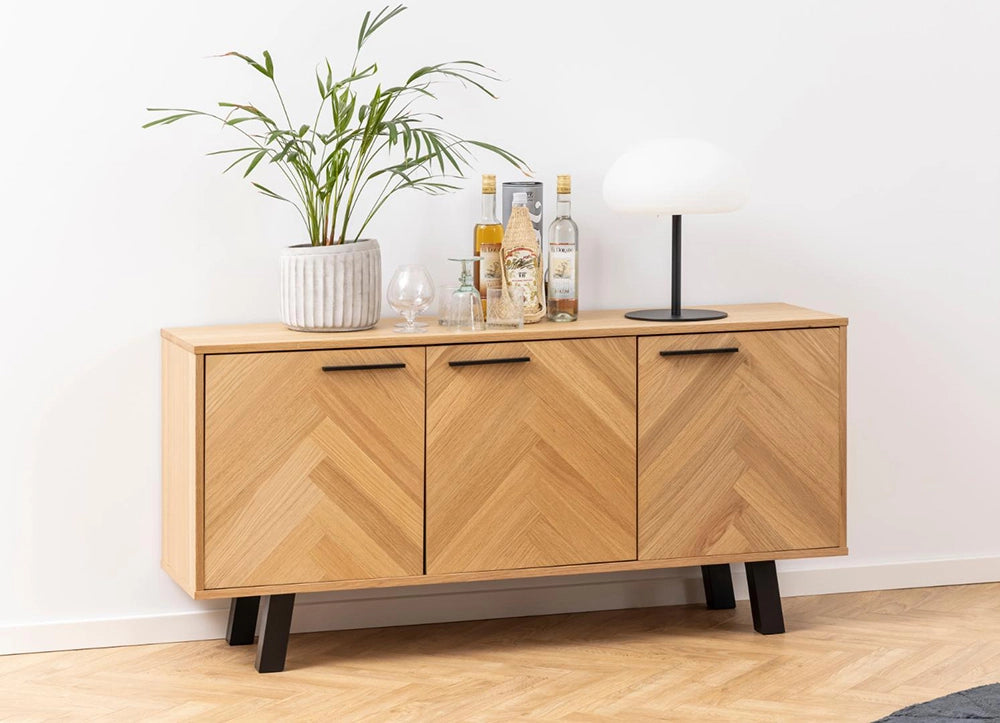 Hamilton Sideboard in Oak Finish with Table Lamp and Indoor Plant in Breakout Setting