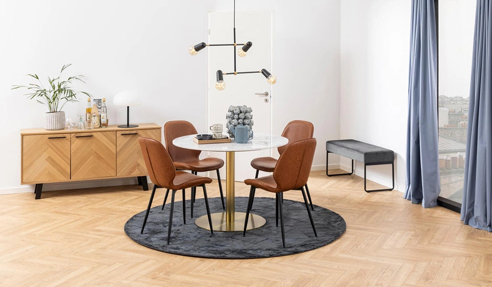 Hampton Round Dining Table in Marble Brass Finish with Leather Chair and Wooden Cupboard in Breakout Setting