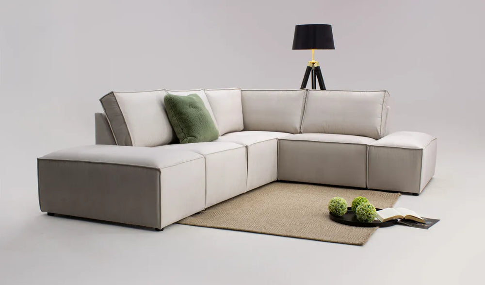 Holden Corner Sofa in Beige Finish with Floor Lamp and Rug in Studio Setting
