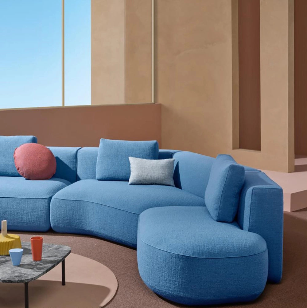 Jeff Corner Sofa with Chaise in Blue Finish with Square Top Coffee Table in Studio Setting 2