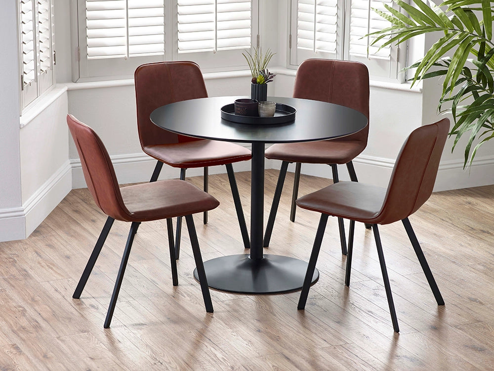 Julio Round Dining Table in Black Finish with Padded Brown Chair and Indoor Plant in Dining Setting